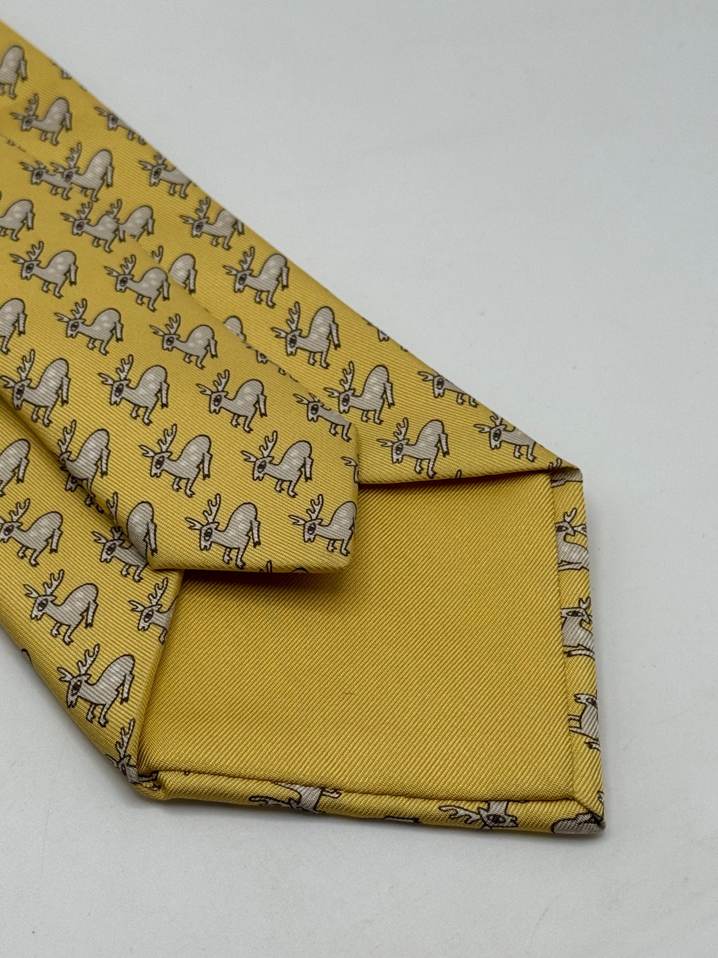 Yellow twill silk tie whit small deer pattern