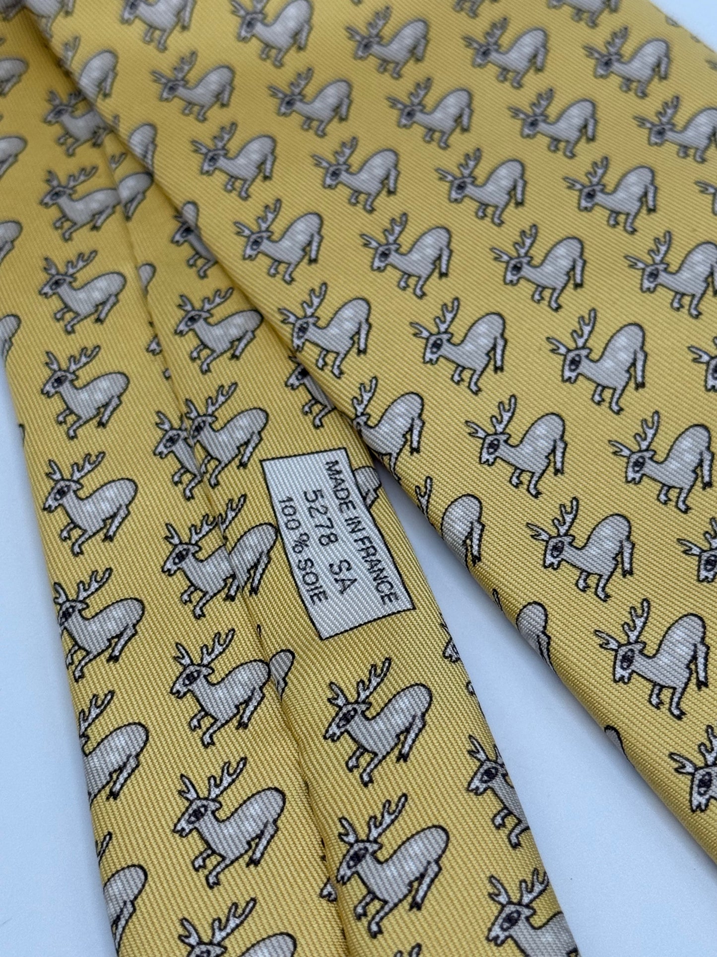 Yellow twill silk tie whit small deer pattern