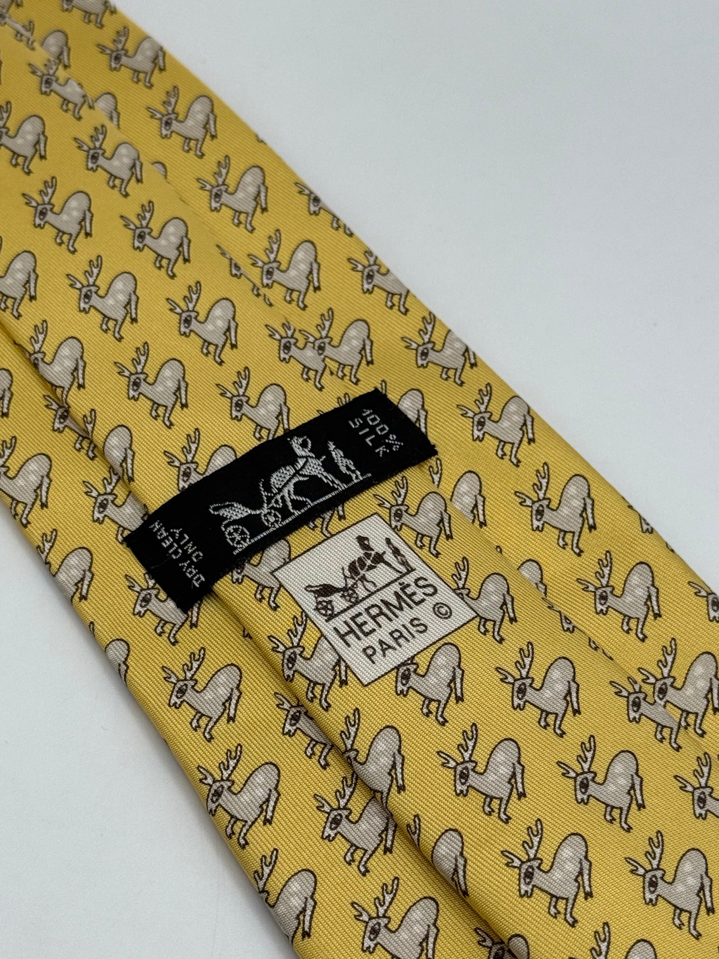 Yellow twill silk tie whit small deer pattern