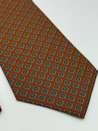 Red silk tie whit geometric pattern