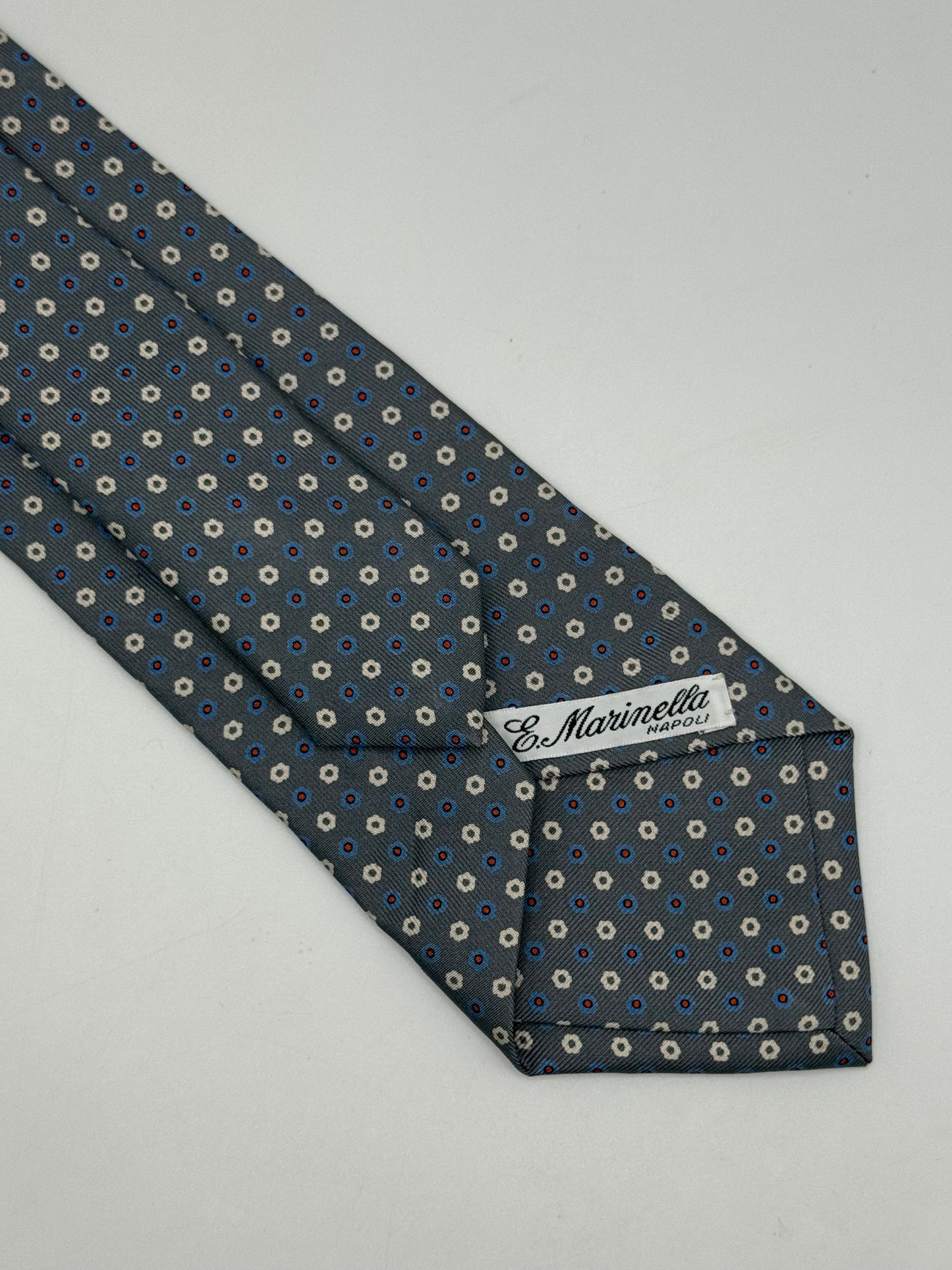 Grey twill silk tie whit small flower pattern