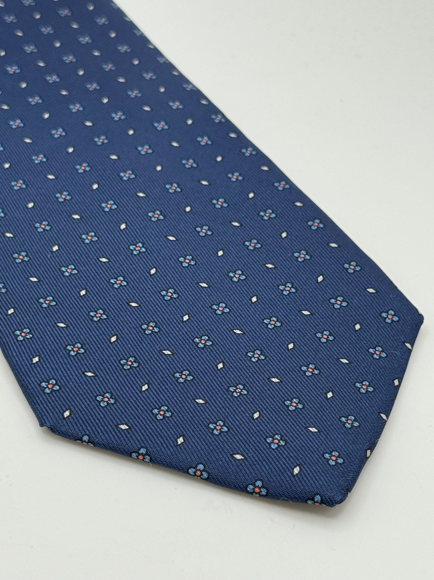Dark blue twill silk tie whit small flower pattern