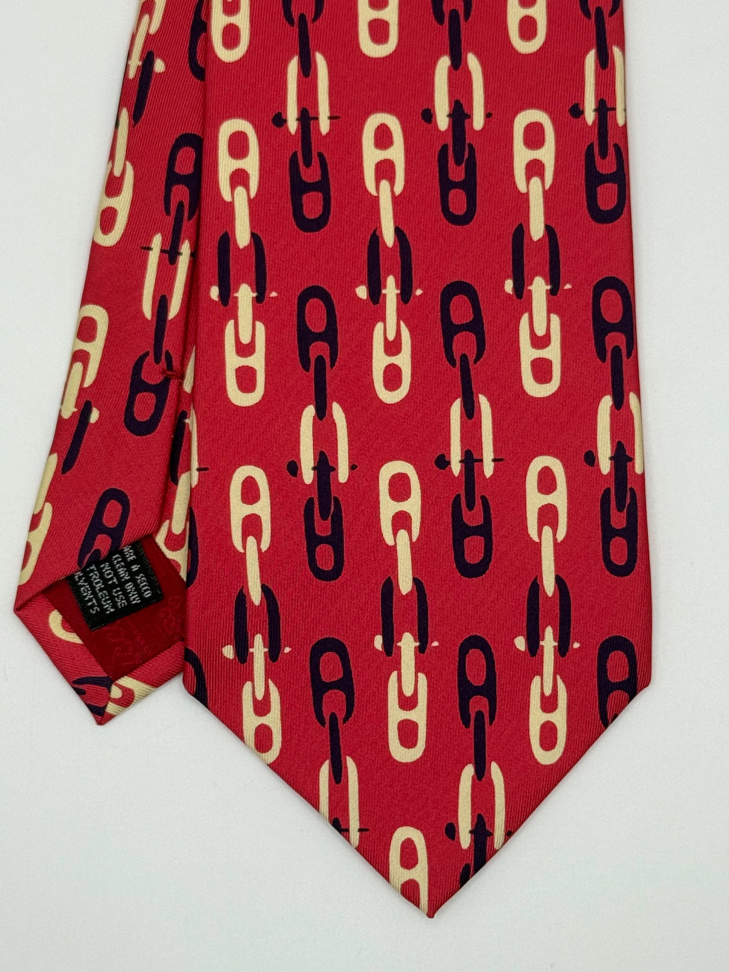 Pink twill silk tie whit clamps pattern