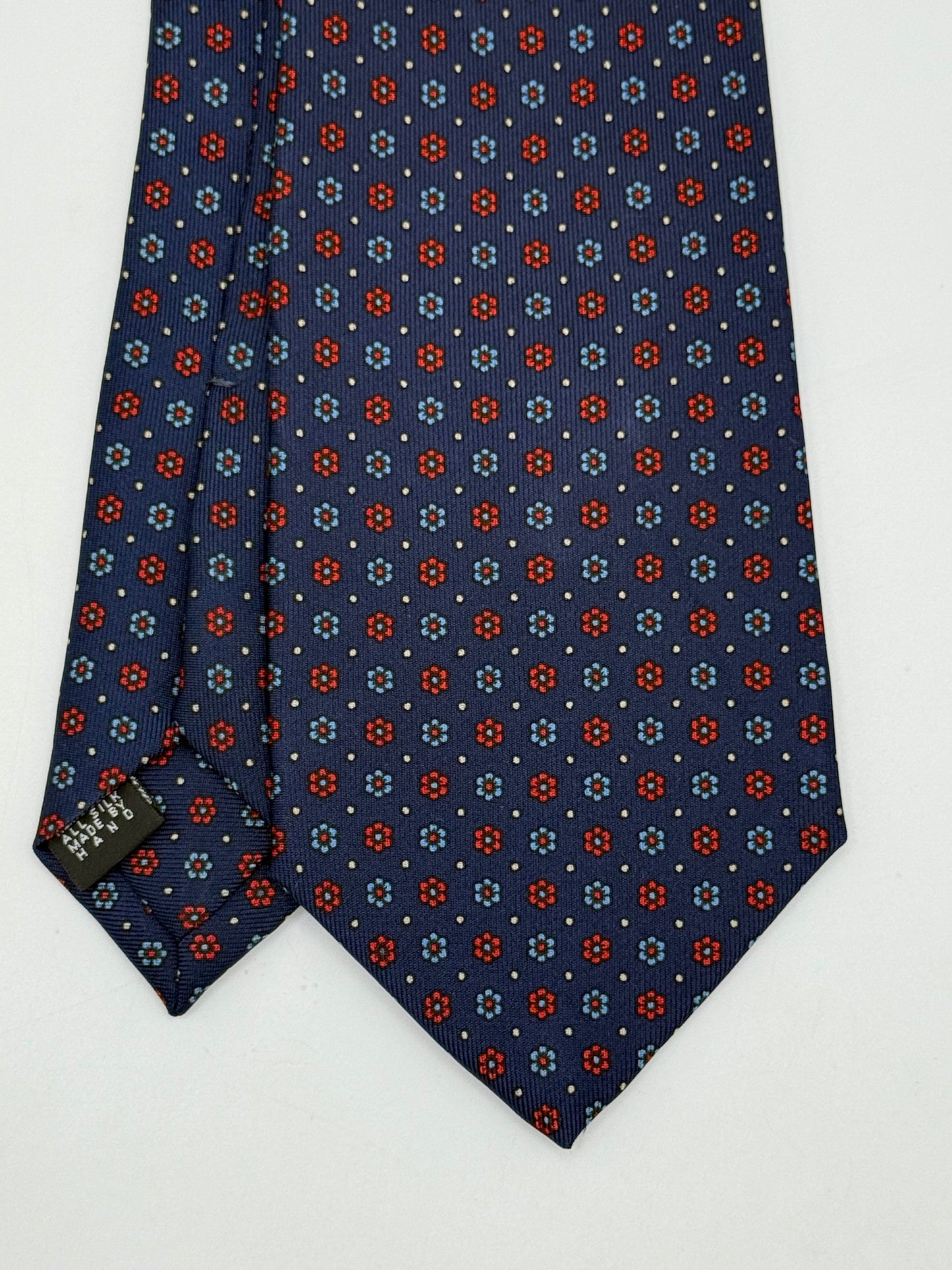 Dark blue twill silk tie whit small flower pattern