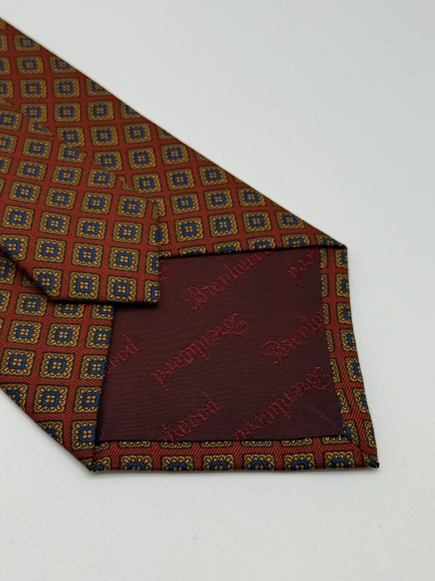 Red silk tie whit geometric pattern