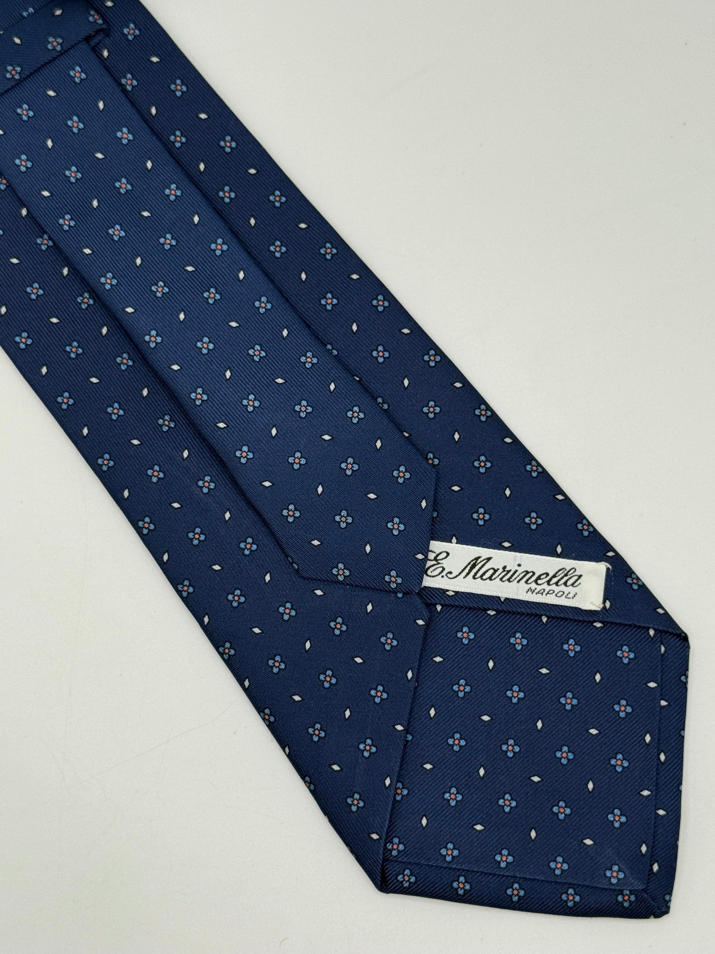Dark blue twill silk tie whit small flower pattern