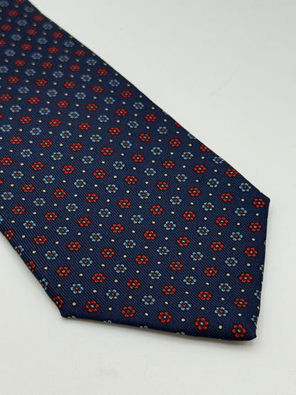 Dark blue twill silk tie whit small flower pattern