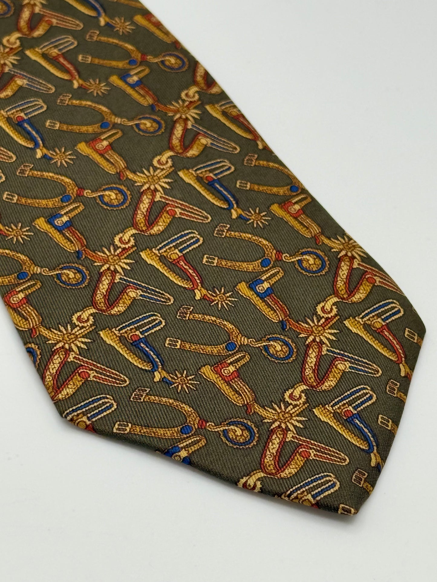 Dark green silk tie whit spurs pattern