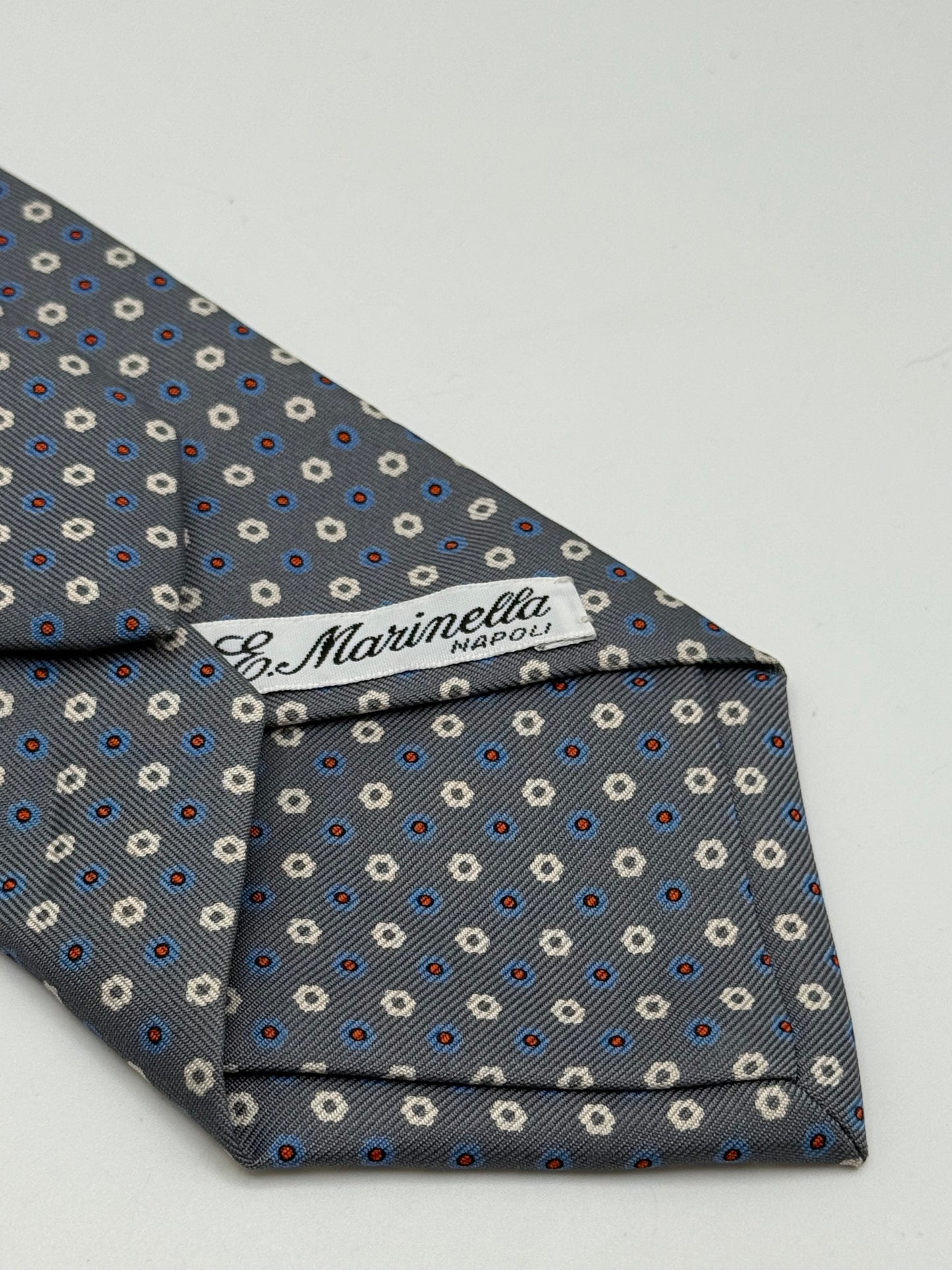 Grey twill silk tie whit small flower pattern