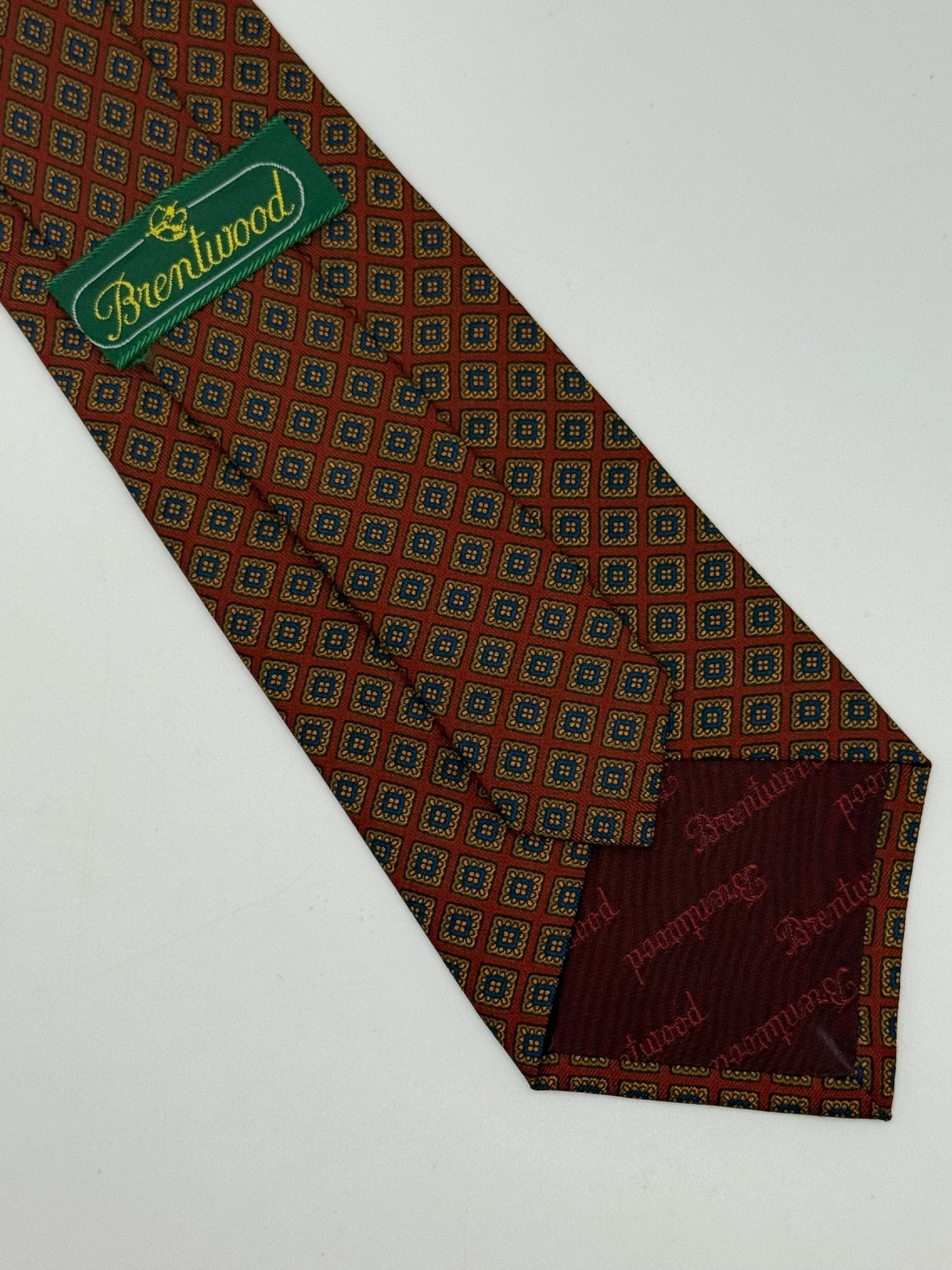 Red silk tie whit geometric pattern